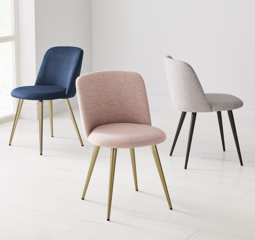 Three chenille West Elm dining chairs in mauve, grey, and navy